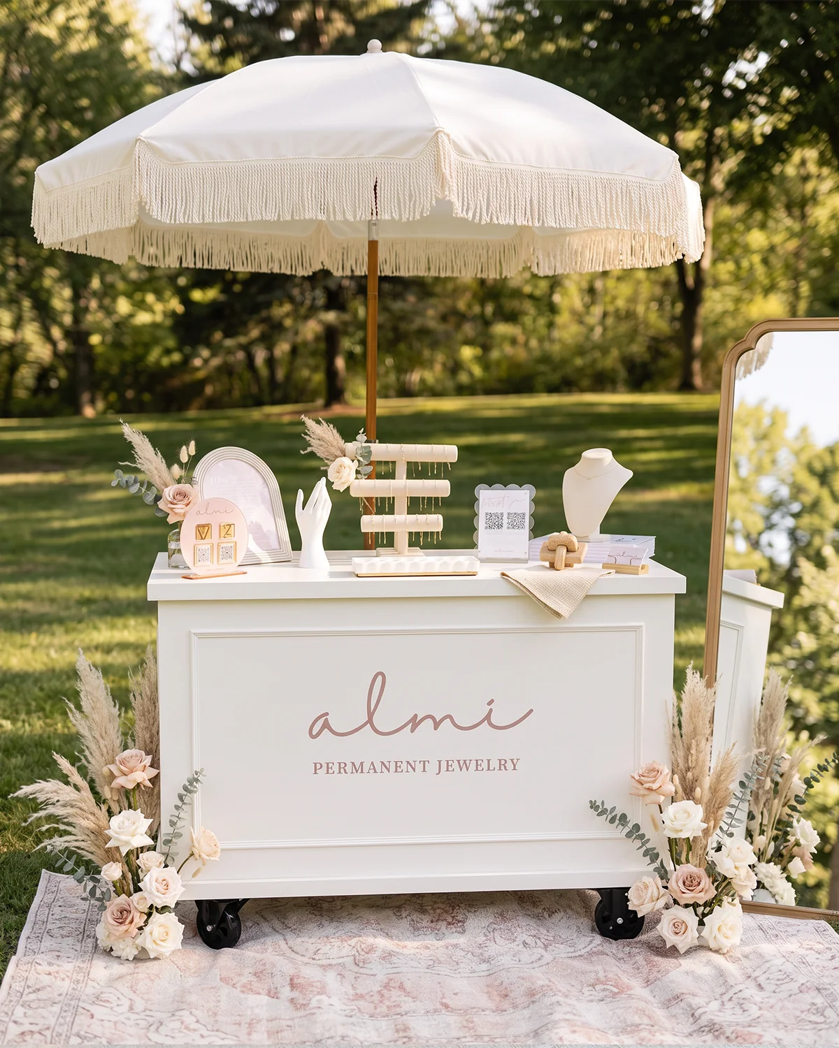 ALMI Permanent Jewelry mobile cart styled for an outdoor event