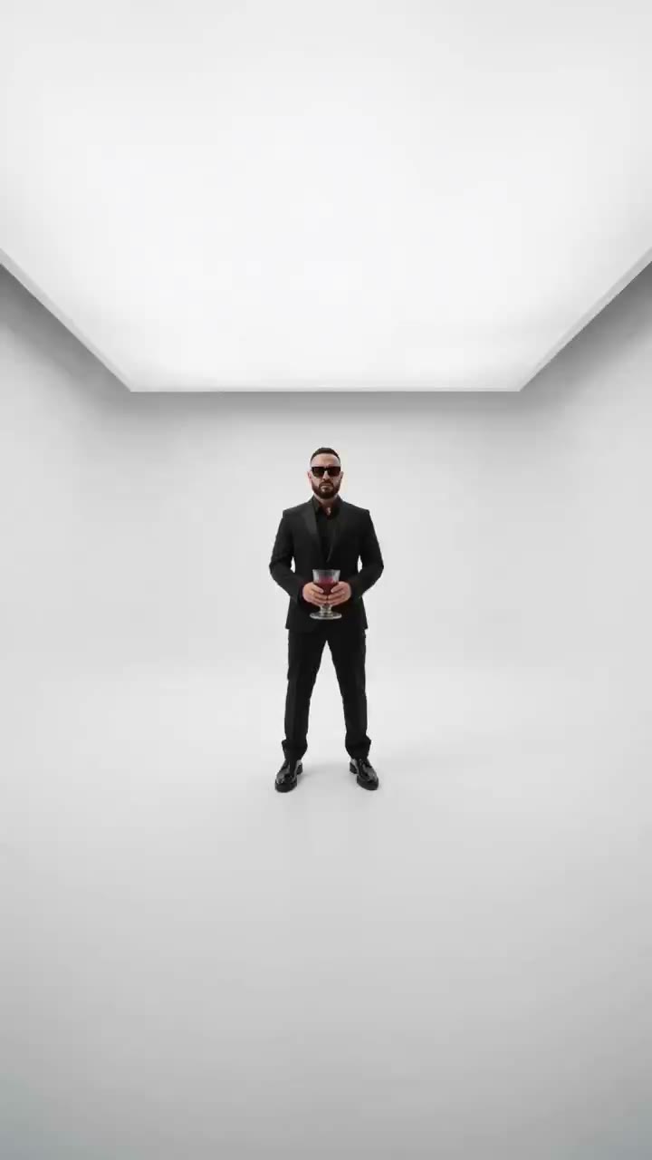 A still figure standing in a white studio