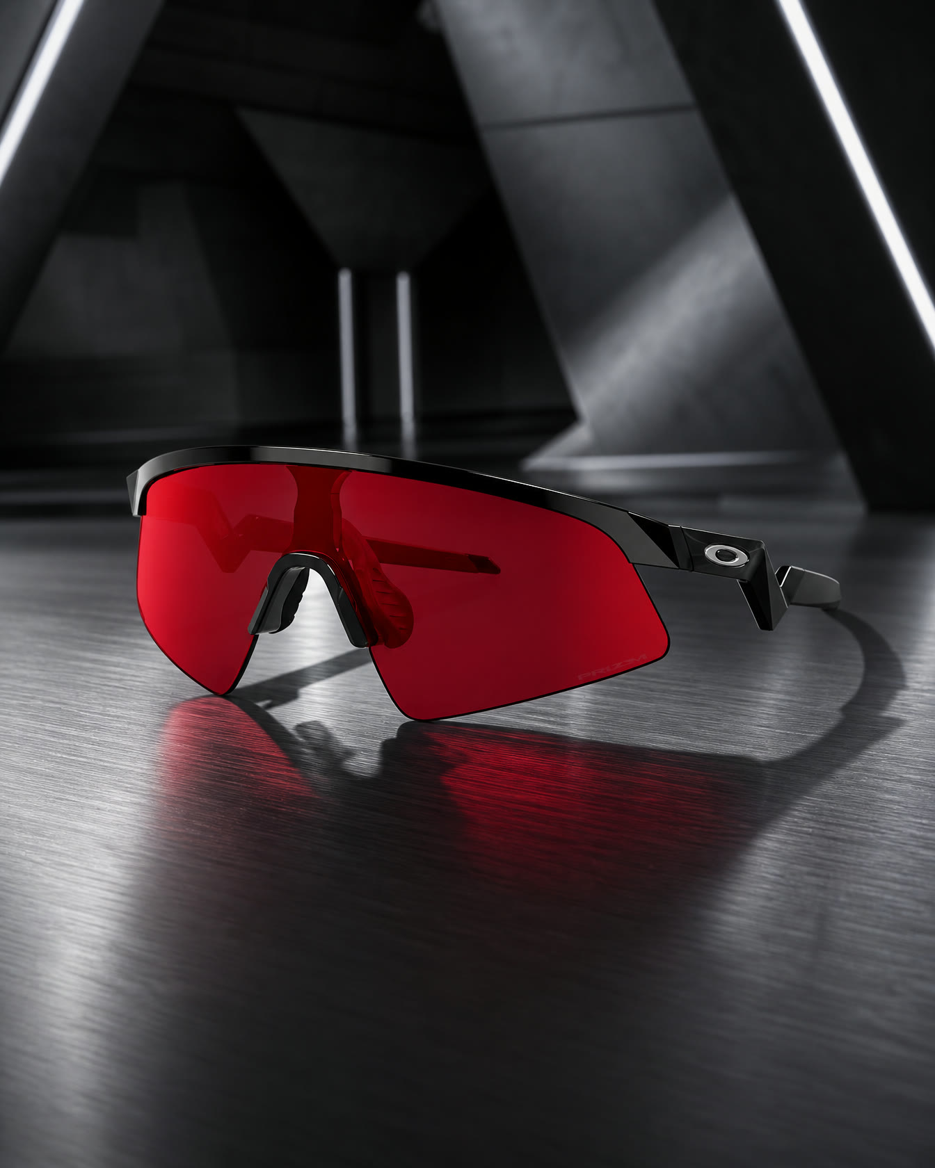 Red performance sunglasses on brushed steel