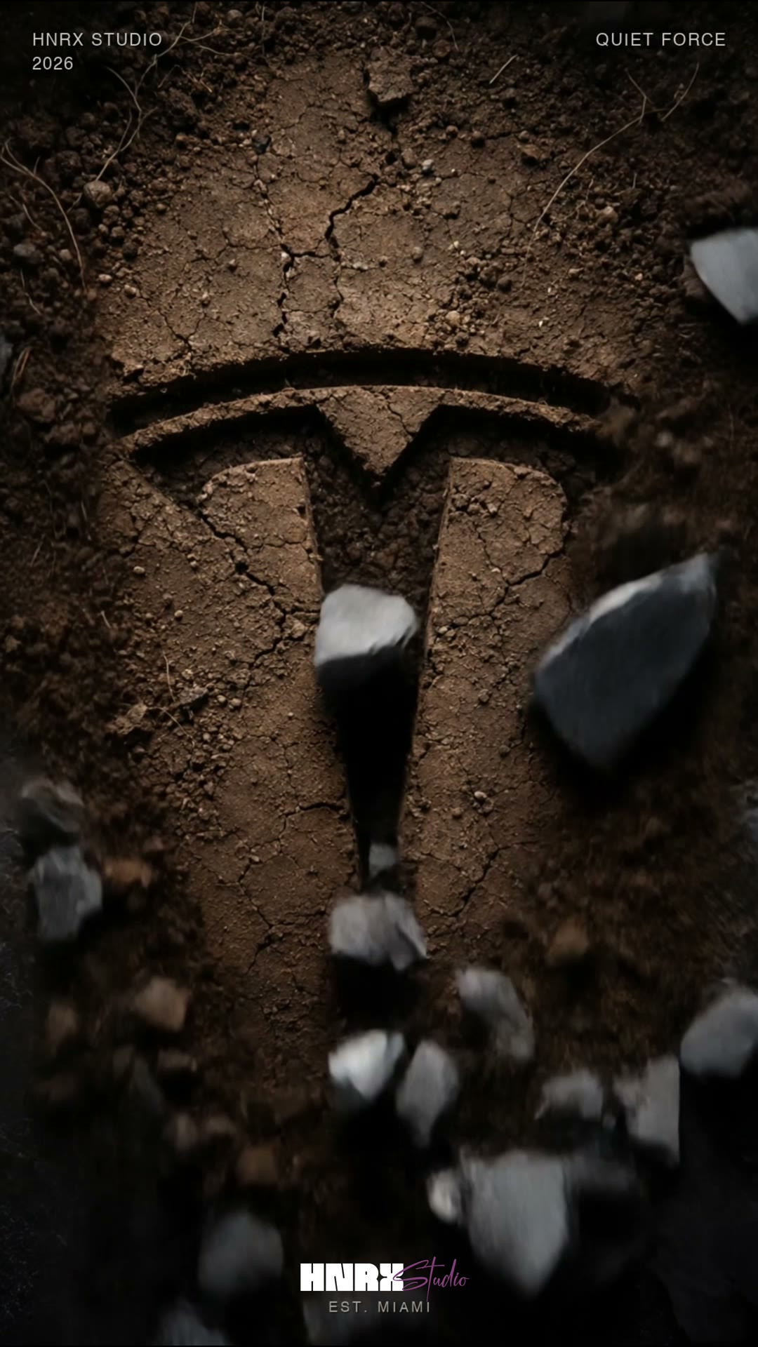 Tesla emblem revealed beneath broken earth and falling fragments