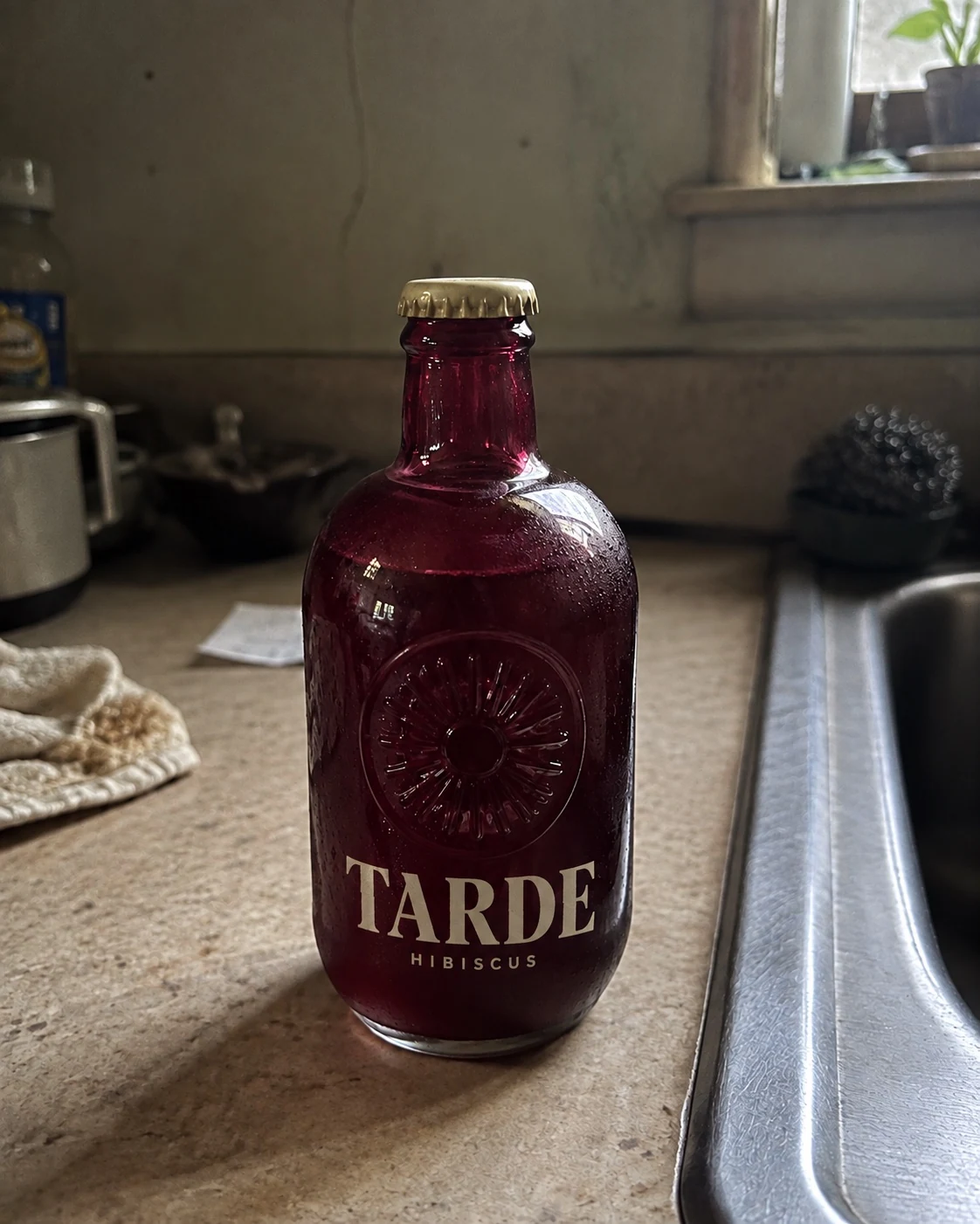 Branded TARDE bottle on an ordinary kitchen counter