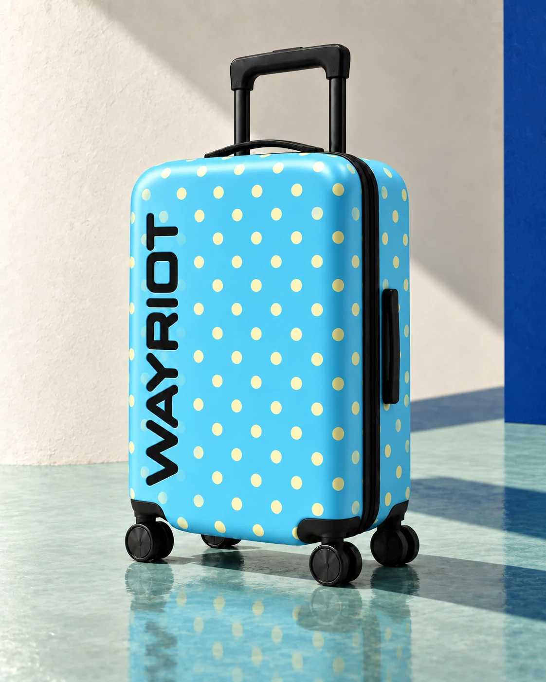 Sky-blue and cream Soft Dots suitcase on a reflective mint floor